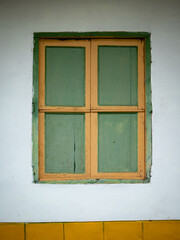 Green and Yellow Window and a White Background, Characteristic of the Town of Jericho, Antioquia, Colombia