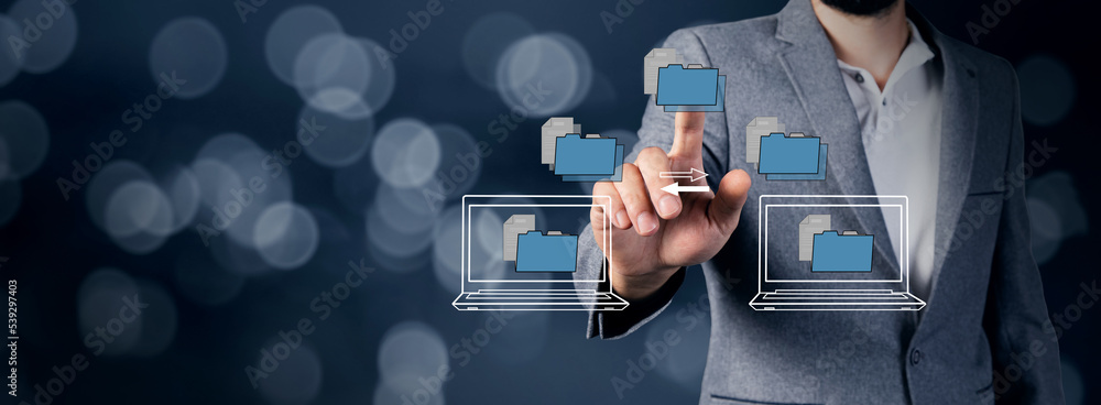 Poster transferring files between laptops on a virtual screen.