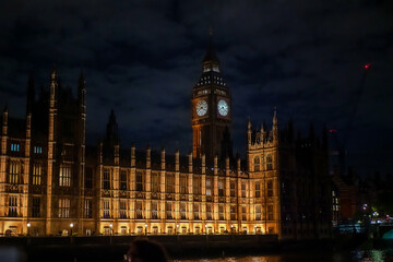 The famous Big Ben and the Parliament House illuminated at night in London