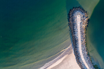 drone aerial view of a harbour breakwater