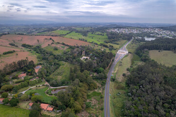 Aerial image of the Romildo Prado highway and its toll booths. Road with vegetation around it and...
