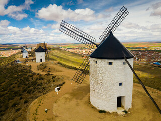 Panoramic view of ancient stone wind mills in Consuegra, Spain - obrazy, fototapety, plakaty