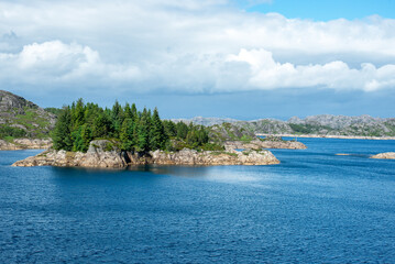 The mountains surrounding Jossingfjord along road 44 between Flekkefjord and Egersund, Sokndal municipality, Norway. This landscape is made of magma, formed by glaciers and unique on earth.