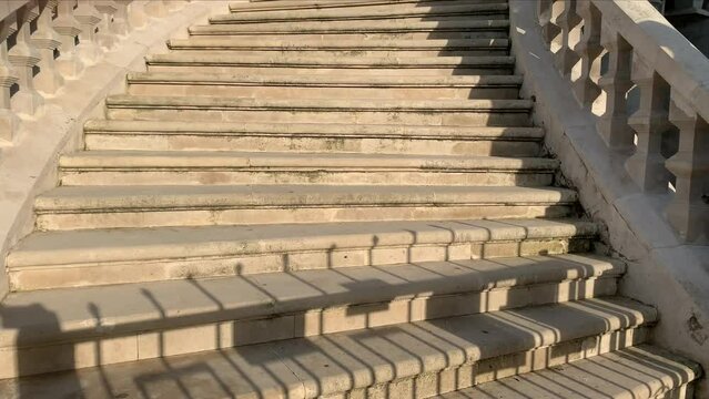 Staircase of a building. Wide stone concrete staircase