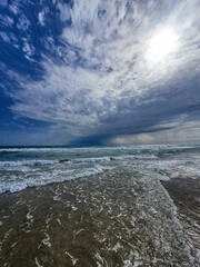 Naklejka na ściany i meble serene seaside landscape with sky with clouds and waves