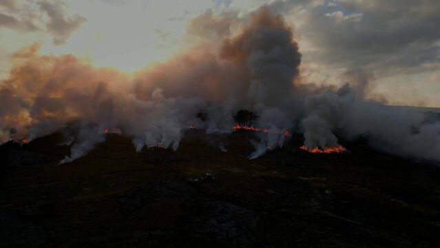 Heather burning on moorland above Holmfirth in West Yorkshire, long history of use in managing moorland. 