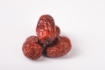 Bowl of Jujube or dried unabi fruit, chinese red date isolated in white background