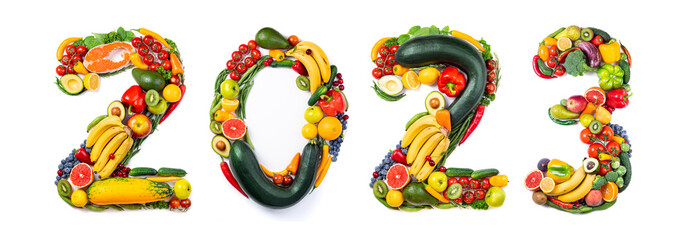 New year 2023 food trends. New Year 2023 made of vegetables, fruits and fish on white background....