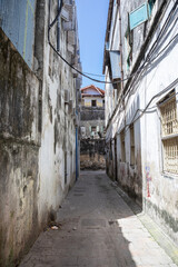 Narrow streets of the old city. Open windows, balconies, antique doors.
