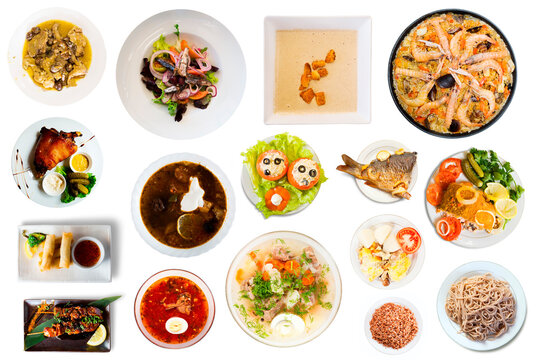 Image of set of many plates with food over white background