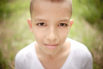 horizontal close-up of latin boy's face looking at camera