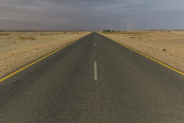 Straight desert road in northern Sudan