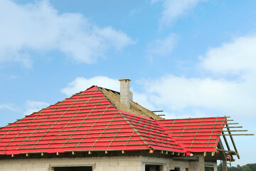 Roof of house under construction against sky