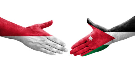 Handshake between Jordan and Monaco flags painted on hands, isolated transparent image.