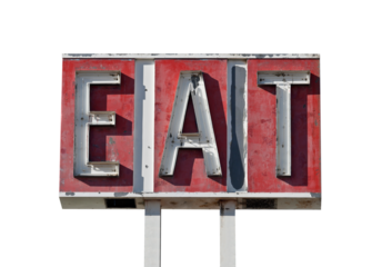 Vintage worn eat sign ruin isolated.