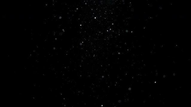 Background of white dust particles flowing in the air. Slow motion. 