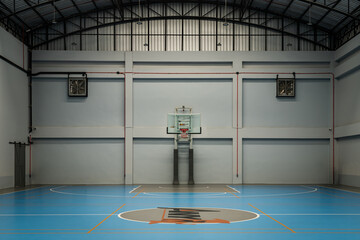 View from Empty basketball gym. Indoor basketball court, Interior of a basketball hall, Space for text, Selective focus. © num