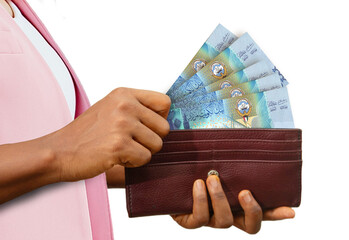 fair Female Hand Holding brown Purse With Kuwaiti dinar notes, hand removing money out of purse...