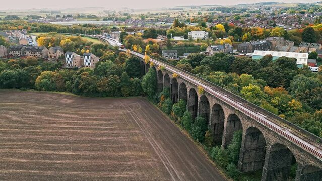 Drone footage of the Penistone Railway Viaduct near Barnsley, South Yorkshire.
Showing a ploughed field, bridge, woodland and railway tracks.