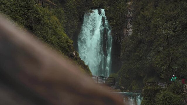 View Of Cascading Peguche Waterfalls In Otavalo. Slider Shot Left