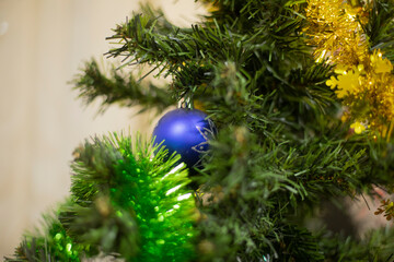 Blue ball on Christmas tree. New decoration on spruce.