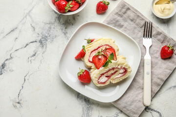Plate with slices of sweet strawberry roll cake on light background