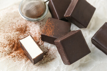 Tasty bird's milk candies on table, closeup