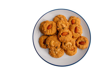 Homemade almond cookies in ceramic white plate on transparent background.