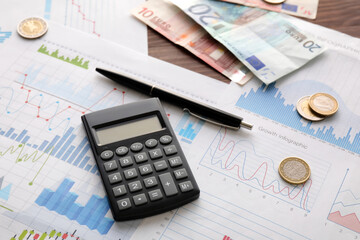 Calculator with money and diagrams on dark wooden background, closeup. Exchange rate concept