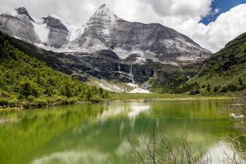 Fototapeta premium Pearl Lake in Yading national level reserve, Daocheng, Sichuan Province, China. Horizontal background image with copy space for text