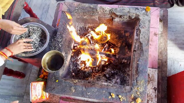 hindu holy rituals with fire from top angle at day