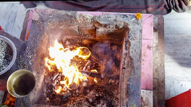 hindu holy rituals with fire from top angle at day