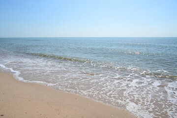 Fototapeta na wymiar sea and sand with blue sky, natural background