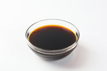 Bowl with traditional vinegar on white background.