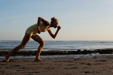 Fototapeta na wymiar beautiful woman jogging on the beach
