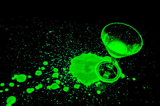 Cocktail Glass with Green Glowing Spill