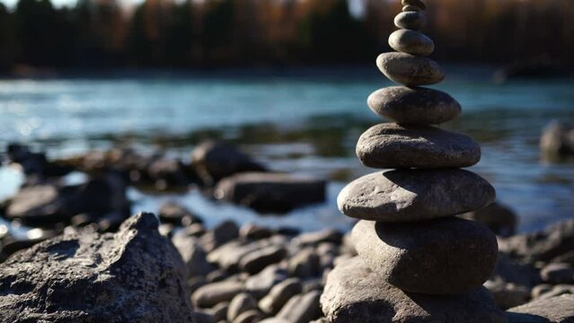 A pyramid of stones on the bank of the river. balance in nature.