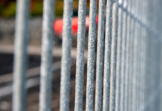 an iron fence made of vertical metal bars