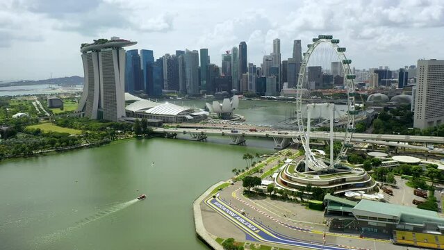 Drone Aerial view 4k Footage of Gardens By The Bay, Flying Towards Skyline Singapore. Marina Bay In Singapore. Singapore Flyer