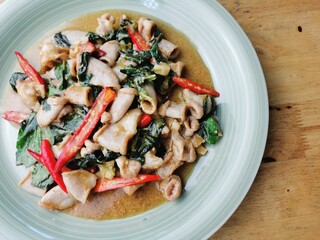 Stir fried intestines with basil in a plate
