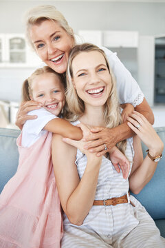 Portrait Of Grandmother, Mother And Girl Child With Smile Sitting On Sofa To Relax, Bond And Hug. Happy Grandma, Mom And Kid Relaxing On Couch Together In Living Room Of The Family Home In Australia.