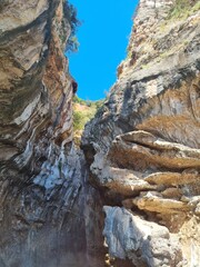 view to the top inside a grotto at the coastline at gulf of orosei, sardegna