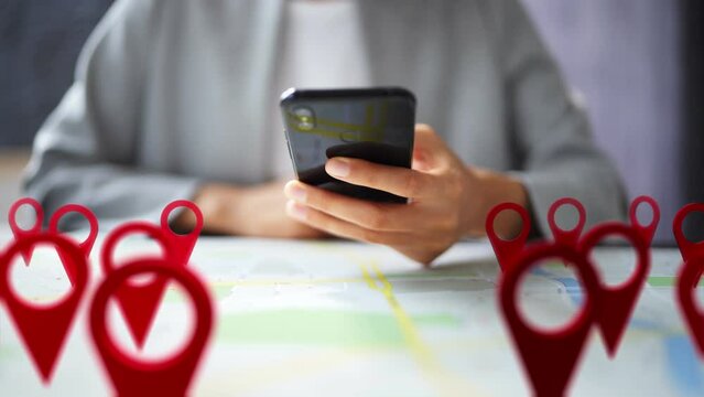 Person Using Map With Red Location Markers