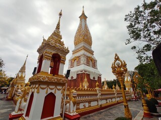 Fototapeta premium Wide angle of Phra That Phanom and the second wall inside Wat Phra That Phanom. This temple is a popular destination for those born in the year of the Monkey.