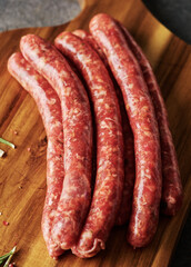 Raw Beef bratwurst. German sausages. Rinderbratwurst. Fresh raw beef sausages. Close up.