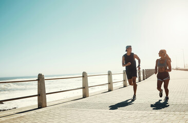 Fitness, couple and running for exercise by beach in workout, training and cardio in South Africa...