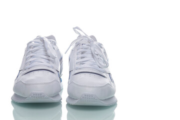 Pair of of New White Sneakers Placed Against White Background.
