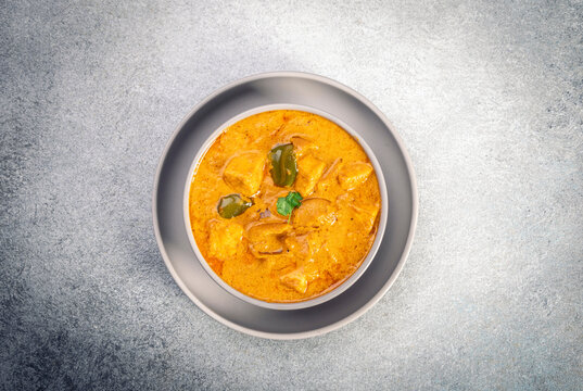 Kadai Paneer is a spicy, flavourful and delicious gravy dish made with  paneer, bell pepper, and onion in freshly ground spices and served in a bowl 