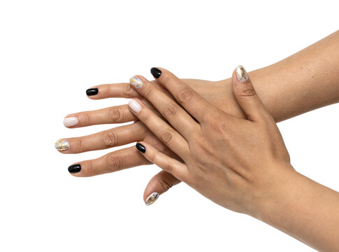 manicure on hands in white and black colors