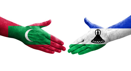 Handshake between Lesotho and Maldives flags painted on hands, isolated transparent image.